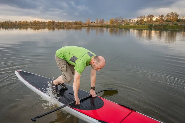 Fitness on stand up paddleboard — Stock Photo, Image