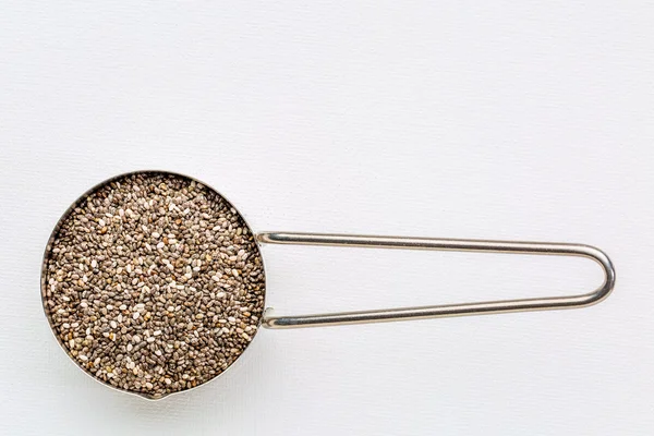 Chia seeds in metal scoop — Stock Photo, Image