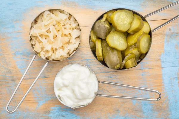 Sauerkraut, cucumber pickles and yogurt — Stock Photo, Image