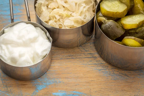 Sauerkraut, pickles and yogurt — Stock Photo, Image