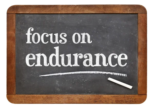 Focus on endurance advice on blackboard — Stock Photo, Image