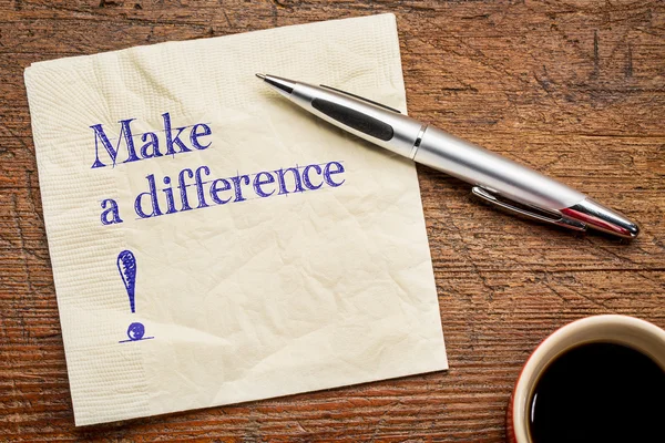 Make a difference text on napkin — Stock Photo, Image