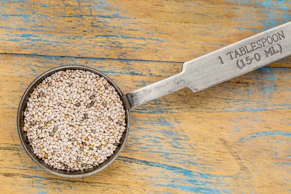 White chia seeds on a tablespoon — Stock Photo, Image