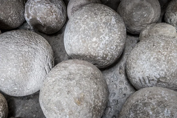 Heavy stone balls in an old building — Stock Photo, Image