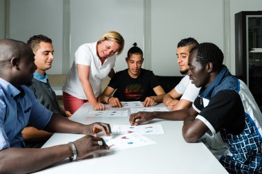 Language training for refugees in a German camp clipart