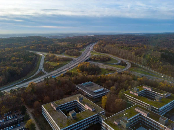 Aerial view over the famous Eiermann Campus in Stuttgart over the highway A8 towards Leonberg. The Eiermann Campus was planned by famous Bauhaus architect Egon Eiermann from 1965 on and was used as an — Stock Photo, Image