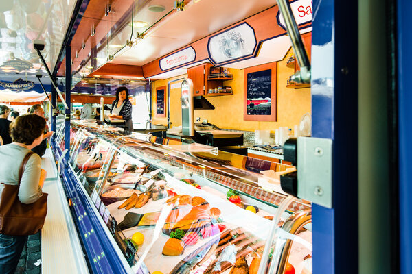 Fishmonger at old Fish Market by the harbor in Hamburg, Germany