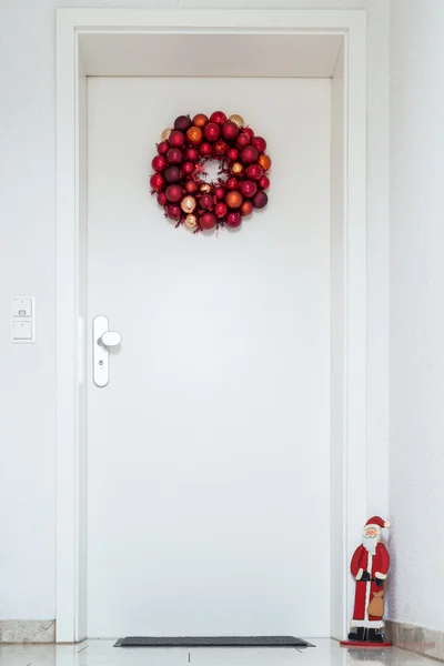 Christmas wreath on entrance door — Stock Photo, Image