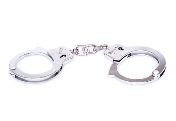 Closed handcuffs on white background — Stock Photo, Image