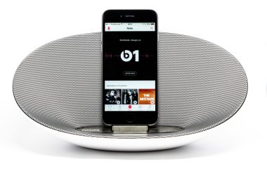 iPhone 6 with loudspeaker displaying the Apple Music radio screen clipart
