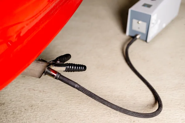 Sensor device measuring exhausts of a car in garage — Stock Photo, Image