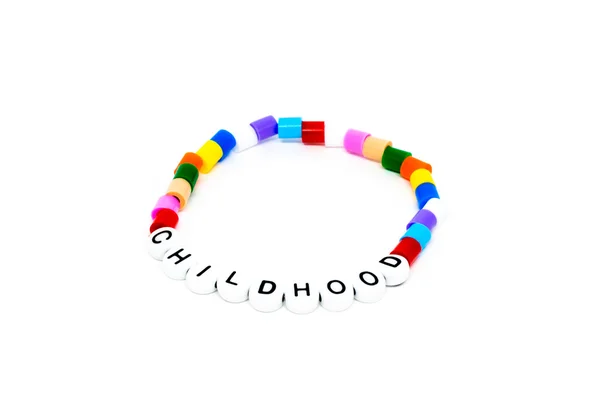 Childhood bracelet on white — Stock Photo, Image