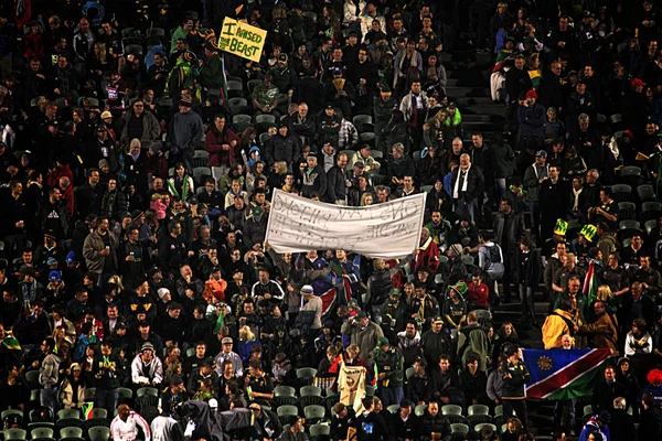 Fans and rugby supporters waving flags — Stock Fotó