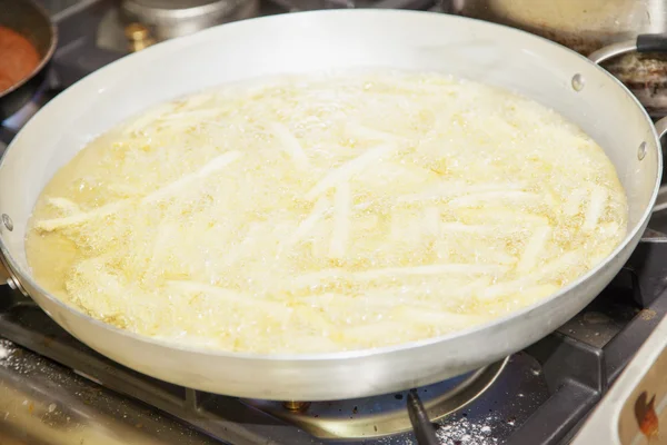 Fried potatoes in pan — Stock Photo, Image