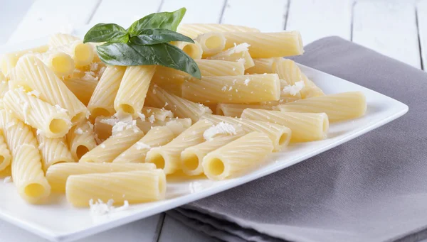 Pasta with cheese and basil — Stock Photo, Image