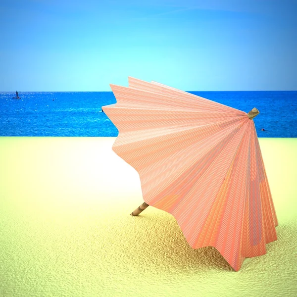 Guarda-chuva amarelo sobre uma praia — Fotografia de Stock