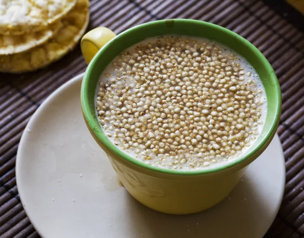 Quinoa flakes in milk cup — Stock Photo, Image