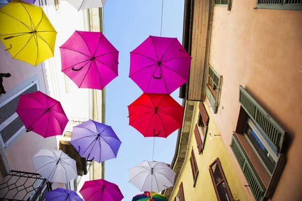 Flying colourful umbrellas — Stock Photo, Image