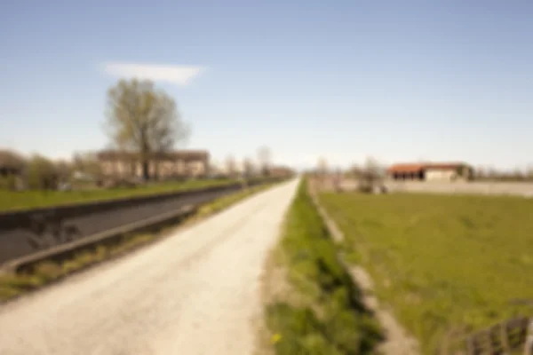 Straße in den Feldern — Stockfoto