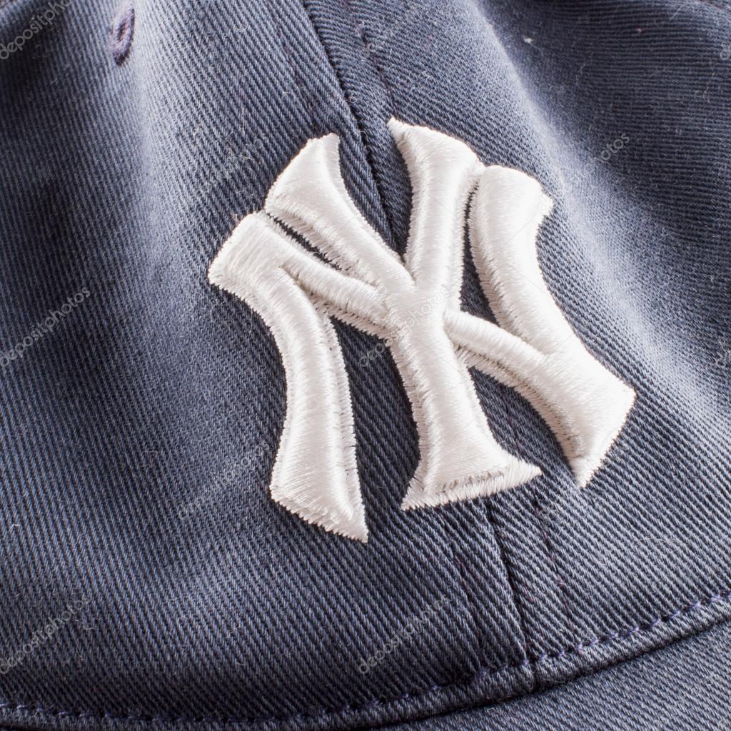 CASALE MONFERRATO, June 29, 2015: New York Yankees symbol over blue tissue. New York Yankees are the most famous american baseball franchise.