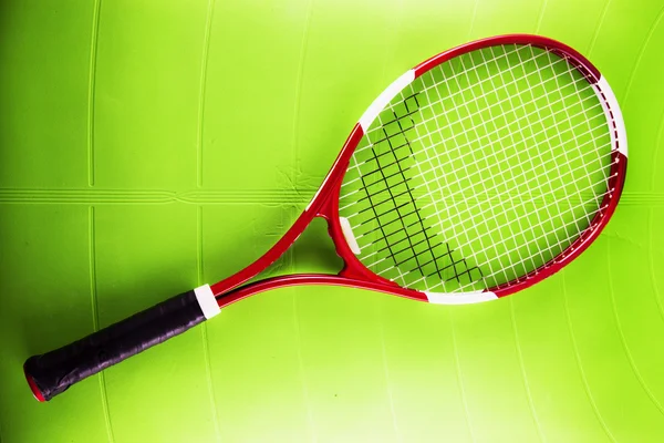 Tennis racket over synthetic surface — Stock Photo, Image