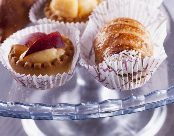 Pastries under glass — Stock Photo, Image