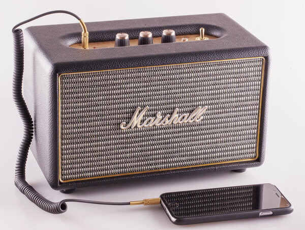 DECEMBER 12, 2015: Marshall amp linked to smartphone. Marshall Amplification is one of leading worldwide brand in sound amplification and musical instruments.