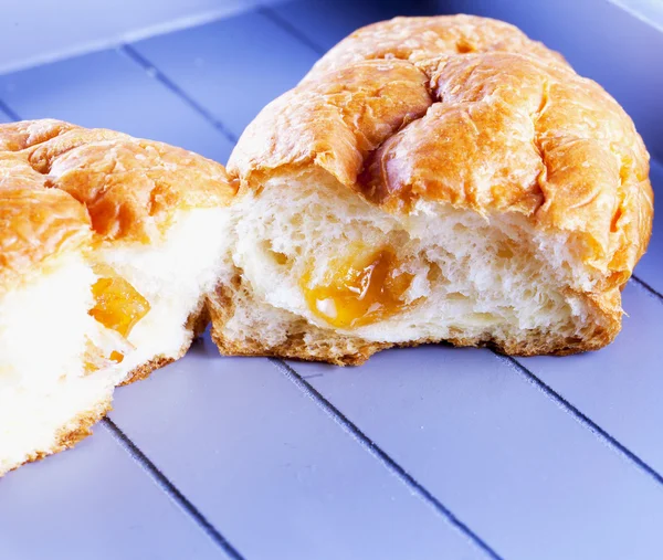 Croissant over wood — Stock Photo, Image