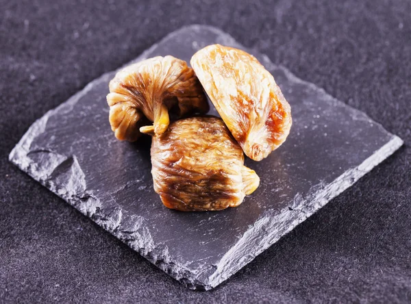 Dried figs over stone — Stock Photo, Image