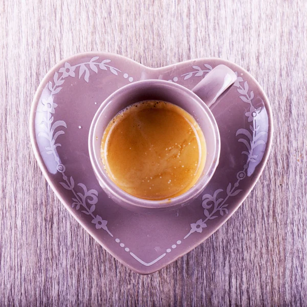 Coffee cup over table — Stock Photo, Image