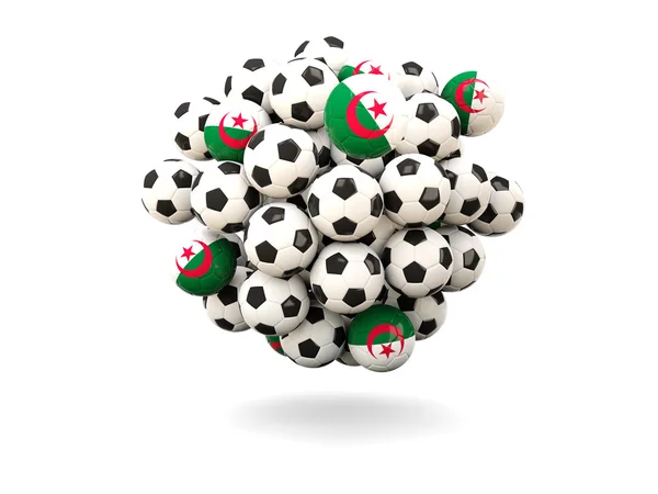 Mucchio di palloni da calcio con bandiera di algeria — Foto Stock