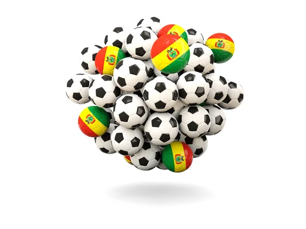 Hög med fotbollar med flagga i bolivia — Stockfoto