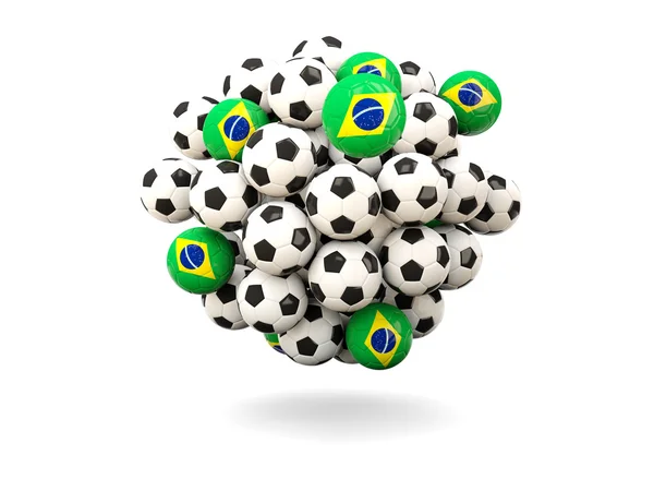 Stapel van voetballen met de vlag van Brazilië — Stockfoto