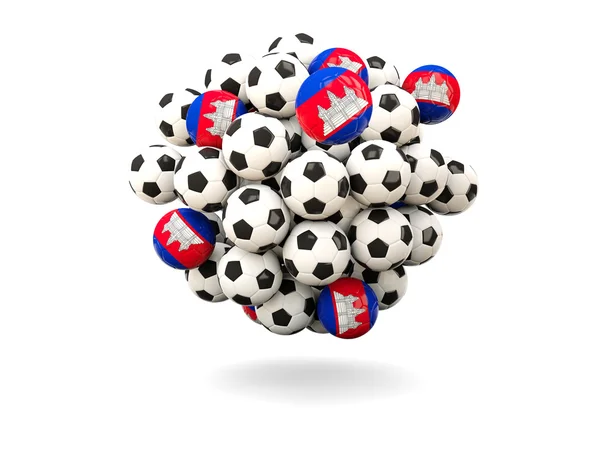 Pilha de bolas de futebol com bandeira de cambodia — Fotografia de Stock