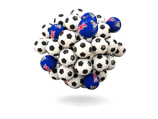 Pilha de bolas de futebol com bandeira de ilhas do Caimão — Fotografia de Stock