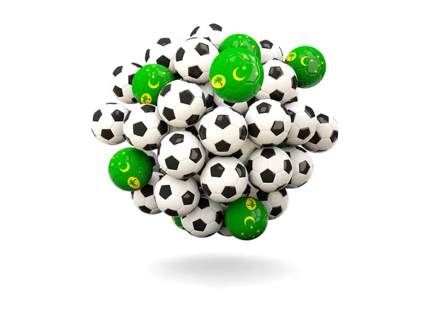 Куча футбольных мячей с флагом кокосовых островов — стоковое фото