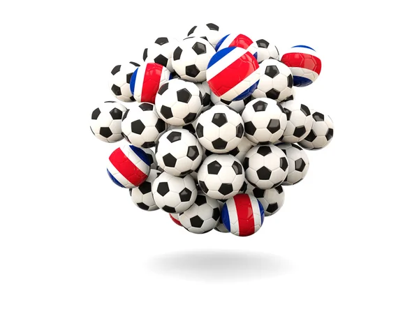 Mucchio di palloni da calcio con bandiera di costa rica — Foto Stock
