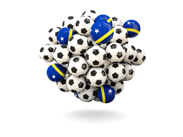 Hög med fotbollar med flagga curacao — Stockfoto