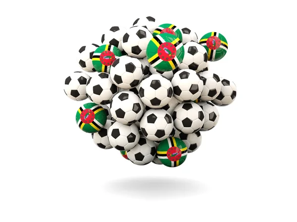 Mucchio di palloni da calcio con bandiera di dominica — Foto Stock