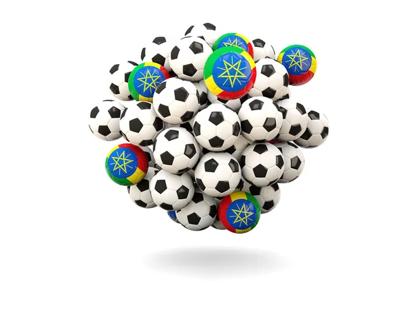 Pilha de bolas de futebol com bandeira de etiópia — Fotografia de Stock