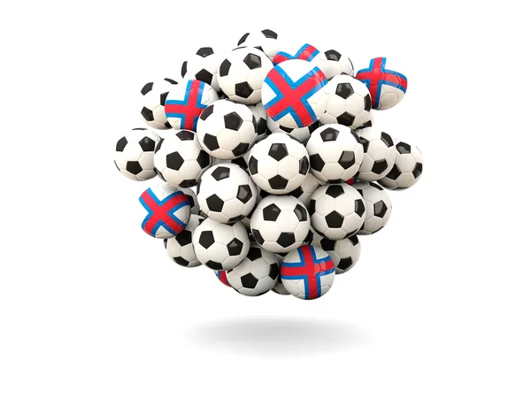 Mucchio di palloni da calcio con bandiera delle isole Faroe — Foto Stock