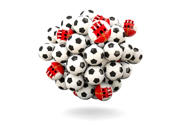 Mucchio di palloni da calcio con bandiera di gibraltar — Foto Stock