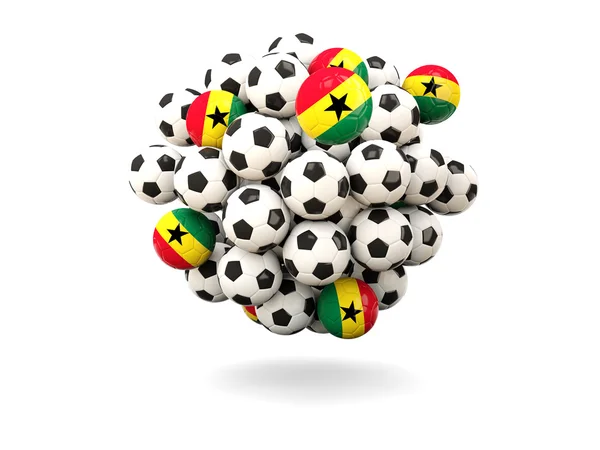 Pilha de bolas de futebol com bandeira de ghana — Fotografia de Stock