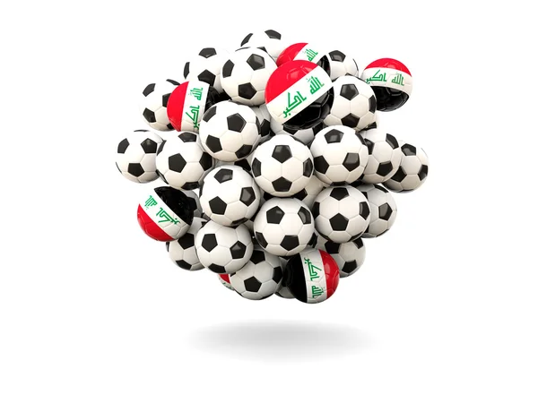 Hromadu fotbaly s vlajkou z Iráku — Stock fotografie