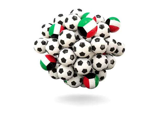 Hög med fotbollar med flagga av kuwait — Stockfoto
