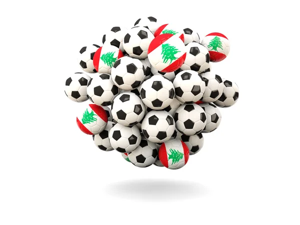 Mucchio di palloni da calcio con bandiera di lebano — Foto Stock