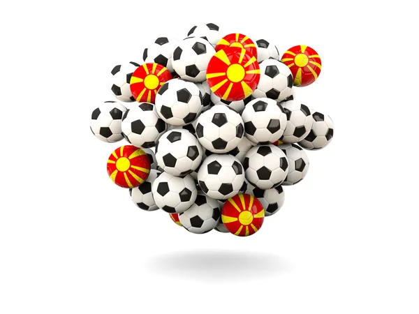 Hög med fotbollar med flagga Makedonien — Stockfoto