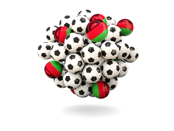 Pile di palloni da calcio con bandiera del Malawi — Foto Stock