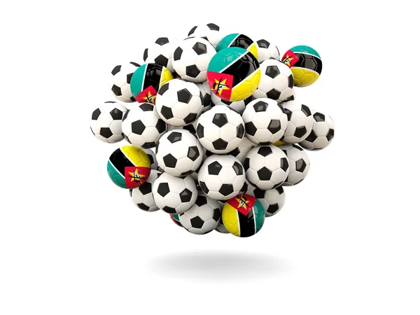 Montón de balones de fútbol con bandera de Mozambique —  Fotos de Stock