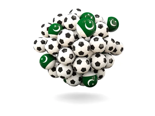Stapel van voetballen met vlag van pakistan — Stockfoto